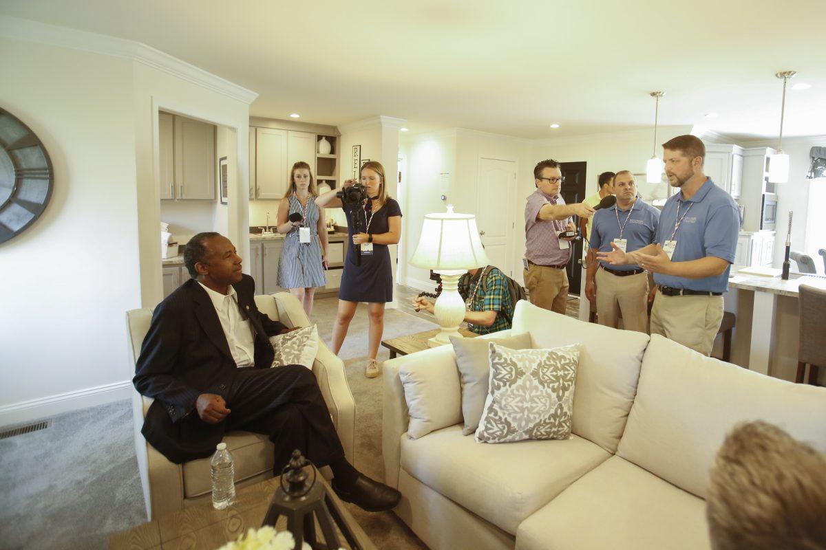 Secretary of Housing and Urban Development Ben Carson (L) visits a house by Skyline Champion homebuilders at the Innovative Housing Showcase on the National Mall in Washington on June 1, 2019. (Samira Bouaou/The Epoch Times)