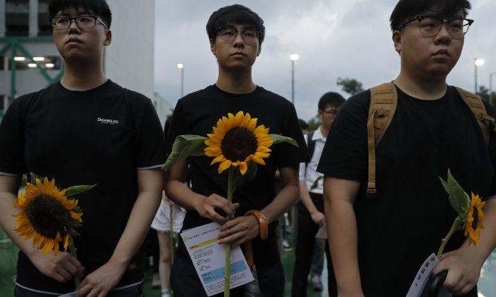 Parents of Dead Hong Kong Protester Urge Others to Carry On