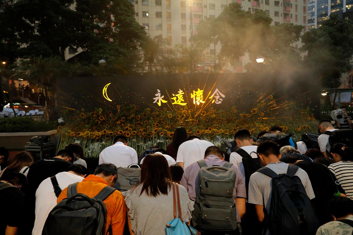 Attendees take part in a public memorial for Marco Leung in Hong Kong on July 11, 2019. (Kin Cheung/AP)