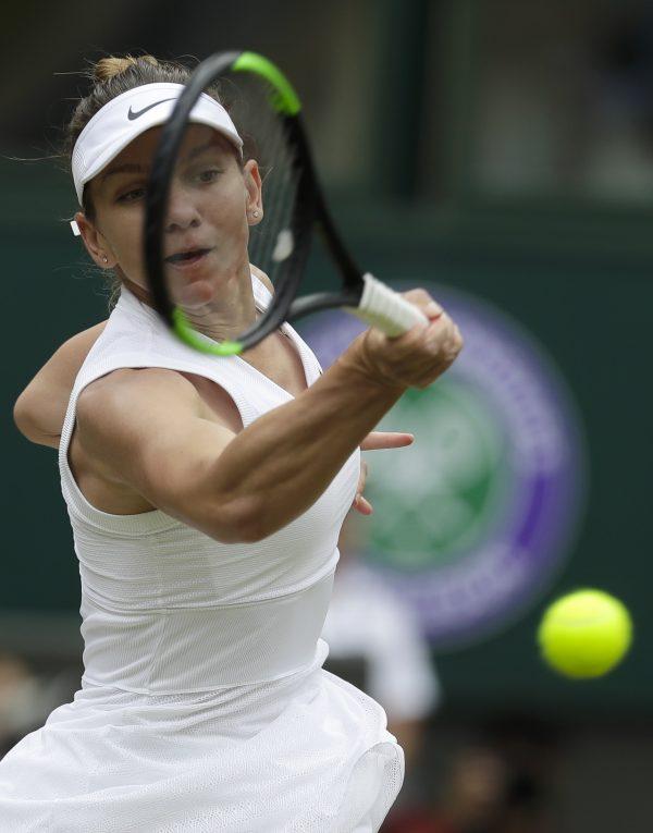 Romania's Simona Halep returns the ball to United States' Serena Williams during the women's singles final match on day twelve of the Wimbledon Tennis Championships in London, on July 13, 2019. (Kirsty Wigglesworth/AP Photo)