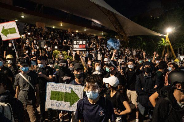 Protesters during a stand-off outside a shopping mall as they clash with police after taking part in a pro-democracy march in the Sha Tin district of Hong Kong on July 14, 2019. (Anthony Kwan/Getty Images)