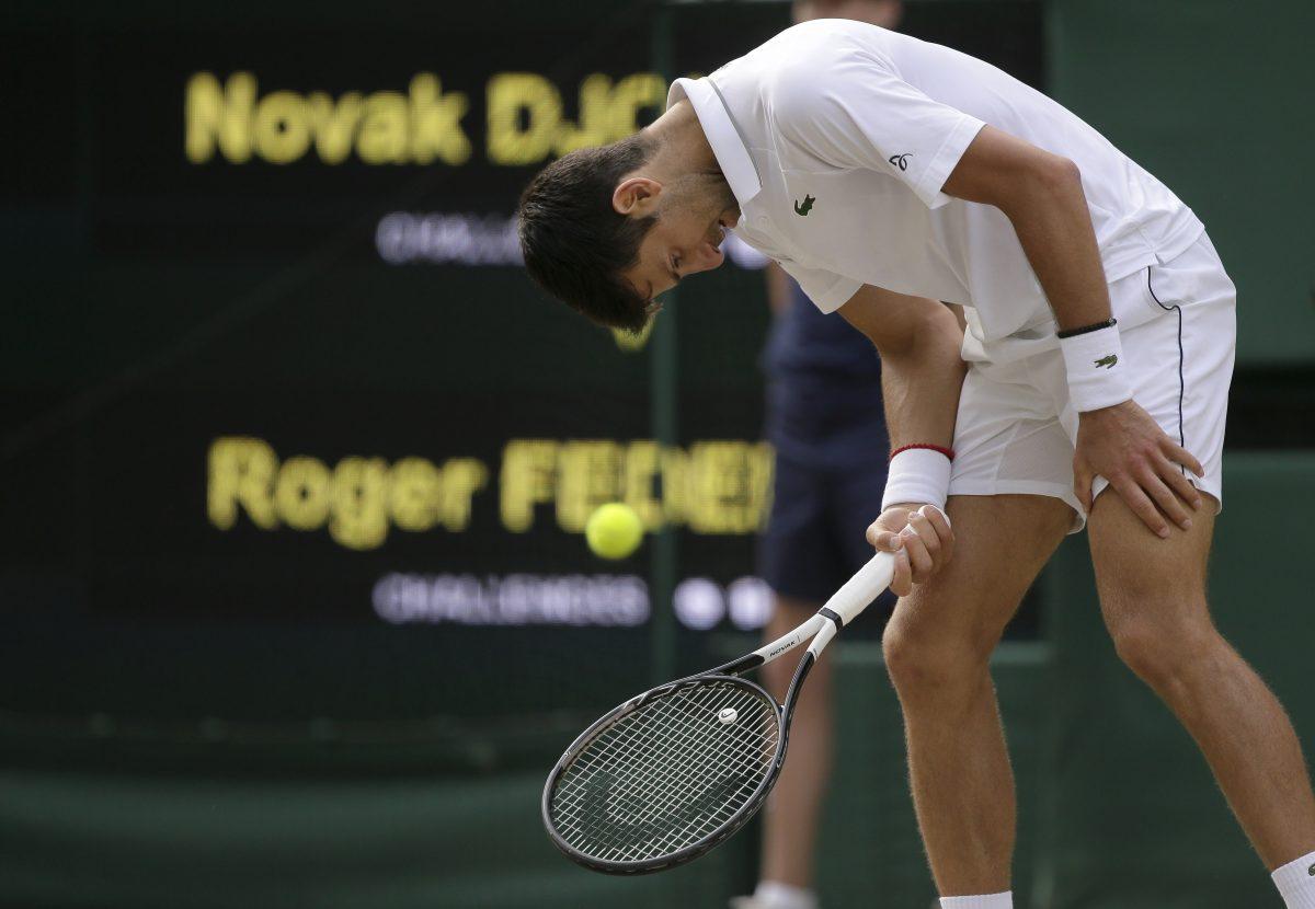 Serbia's Novak Djokovic is dejected after losing a point to Switzerland's Roger Federer during the men's singles final match of the Wimbledon Tennis Championships in London, on July 14, 2019. (Tim Ireland/AP Photo)