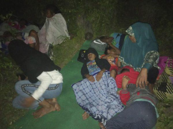 Residents sleep on the ground after leaving their homes to find higher grounds following an earthquake in Gane Utara, North Maluku, Indonesia, on July 14, 2019. (AP Photo)