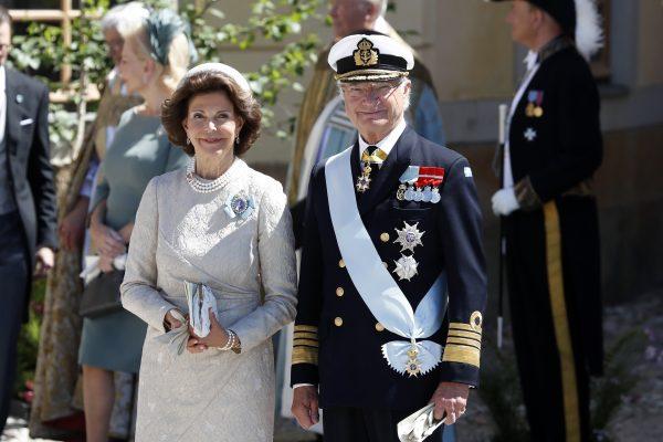 Queen Silvia of Sweden and King Carl XVI Gustaf of Sweden leave the christening of Princess Adrienne of Sweden at Drottningholm Palace Chapel on June 8, 2018 in Stockholm, Sweden. (Michael Campanella/Getty Images)