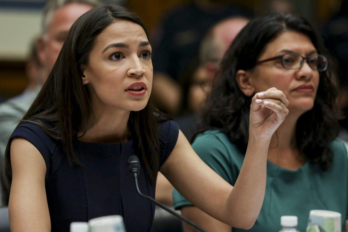  Reps Alexandria Ocasio-Cortez (L) and Rashida Tlaib at a House hearing in front of the Committee on Oversight and Reform, in Washington on July 12, 2019. (Charlotte Cuthbertson/The Epoch Times)