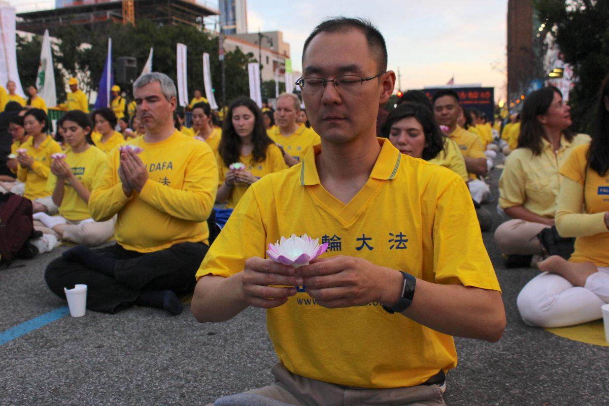 Falun Gong practitioner Zhang Yi at the Chinese consulate at the 20th anniversary of the persecution in China, in New York on July 15, 2019. (Eva Fu/The Epoch Times)