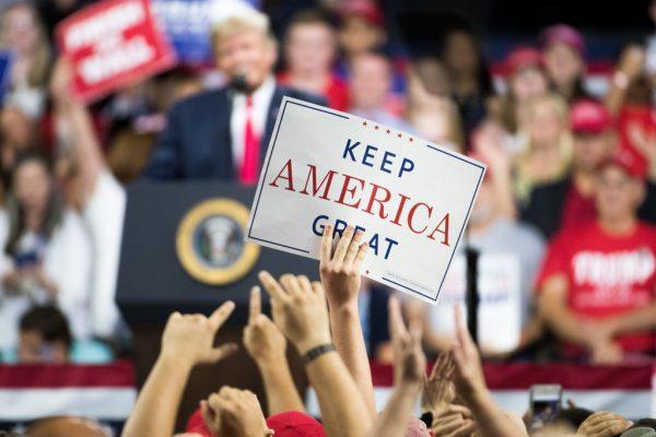 An attendee holds a "Keep America Great" sign as President Donald Trump speaks to the crowd during a campaign rally at Freedom Hall in Johnson City, Tennessee, on Oct. 1, 2018. (Sean Rayford/Getty Images)
