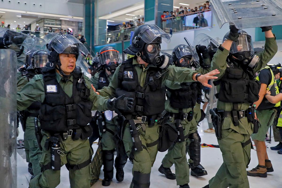 Riot policemen move in to disperse the protesters inside a shopping mall in Sha Tin District in Hong Kong, China on July 14, 2019. (Kin Cheung/AP)