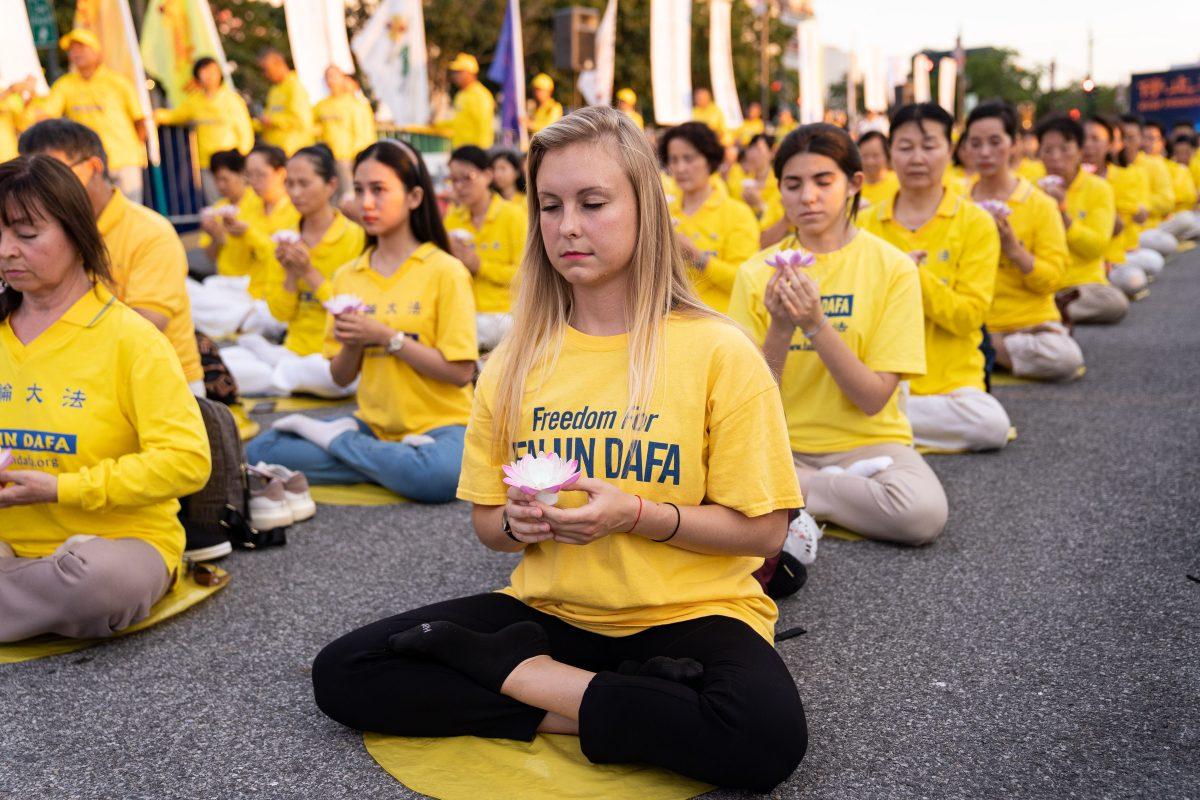 Falun Gong practitioners gathered in front of the Chinese consulate to commemorate the 20th year anniversary of persecution in China, in New York on July 15, 2019. (Larry Dye/The Epoch Times)
