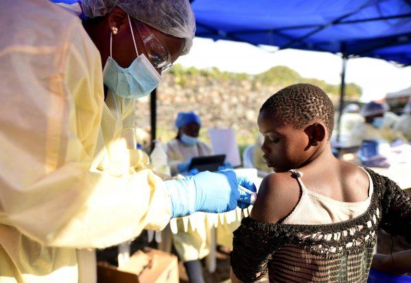 A Congolese health worker administers Ebola vaccine to a child at the Himbi Health Centre in Goma, Democratic Republic of Congo, on July 17, 2019. (Olivia Acland/Reuters)