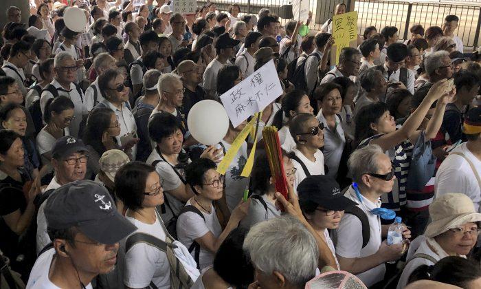 Hong Kong Elders March in Support of Young Demonstrators