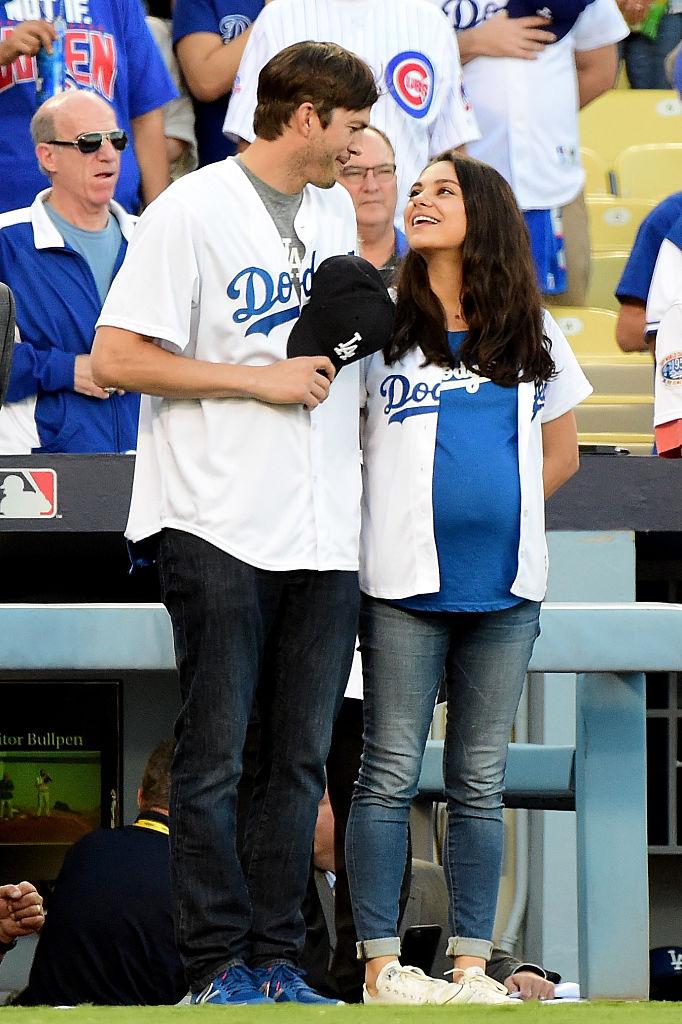 Kutcher and Kunis having fun on the field at Dodger Stadium in Los Angeles on Oct. 19, 2016 (©Getty Images | <a href="https://www.gettyimages.com/detail/news-photo/ashton-kutcher-and-wife-mila-kunis-on-the-field-after-they-news-photo/615688522?adppopup=true">Harry How</a>)