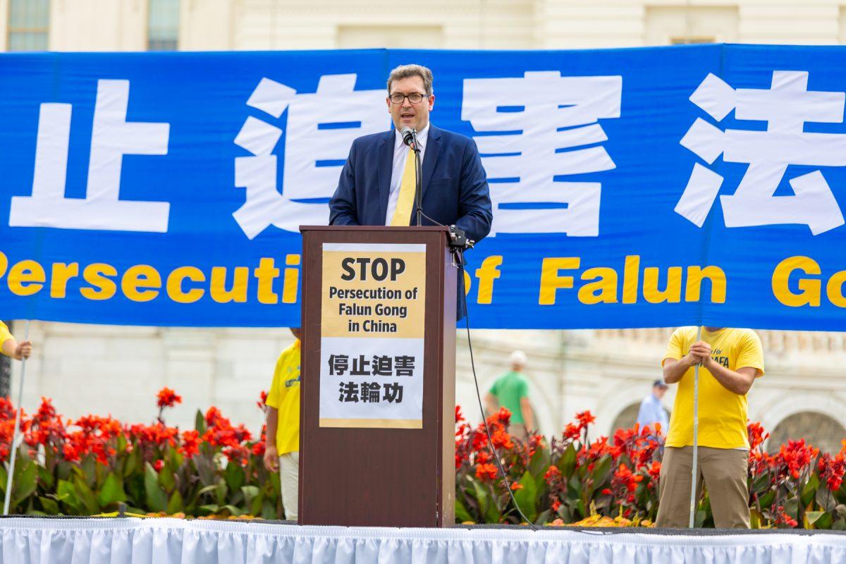 Benedict Rogers, East Asia Team Leader at nonprofit Christian Solidarity Worldwide, at a rally commemorating the 20th anniversary of the persecution of Falun Gong in China, on the West Lawn of Capitol Hill on July 18, 2019. (Mark Zou/The Epoch Times)