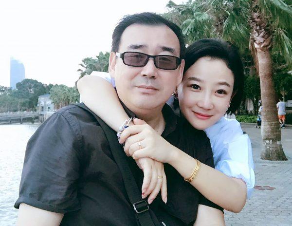 In this 2017 photo provided by his family, Yang Hengjun, left, poses with his family member in Beijing. (Yang Family Photo via AP)