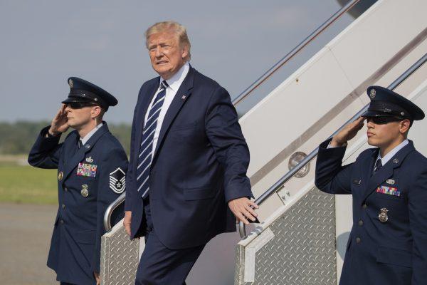President Donald Trump, disembarks Air Force One upon arrival at Morristown Municipal Airport, in Morristown, N.J., on July 19, 2019. (Manuel Balce Ceneta/AP Photo)