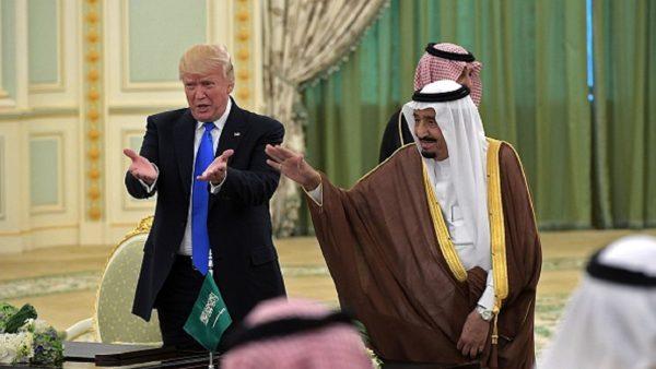 U.S. President Donald Trump (L) and Saudi Arabia's King Salman bin Abdulaziz Al Saud gesture during a signing ceremony at the Saudi Royal Court in Riyadh on May 20, 2017. (Mandelngan/AFP/Getty Images)