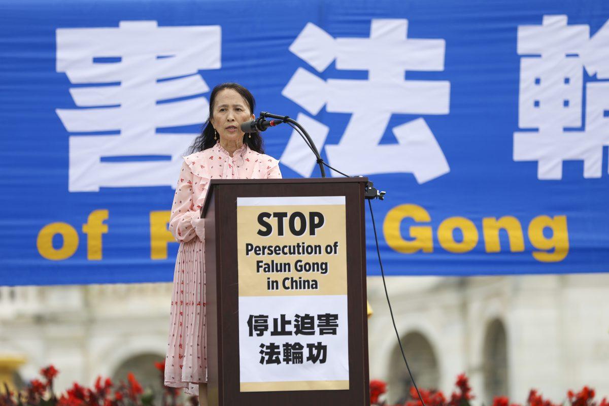 Rong Yi, president of the Tuidang Center, speaks at a rally commemorating the 20th anniversary of the persecution of Falun Gong in China, on the West lawn of Capitol Hill in Washington on July 18, 2019. (Samira Bouaou/The Epoch Times)