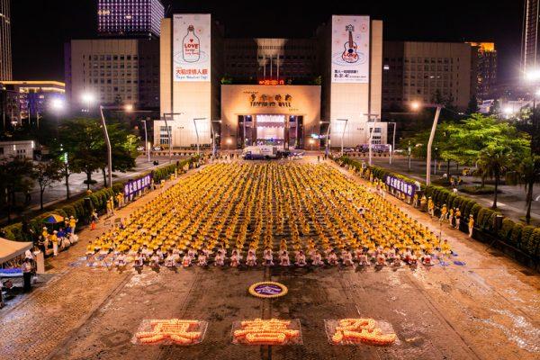 Over 2,000 Falun Gong practitioners hold a candle-light vigil in front of the Taipei City Government in Taipei on July 20, 2019. (Chen Po-chou/The Epoch Times)