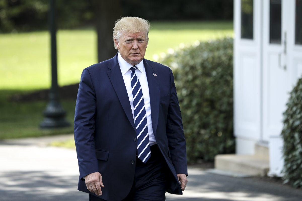 President Donald Trump speaks to media before departing the White House on Marine One en route to Bedminster, N.J., on July 19, 2019. (Charlotte Cuthbertson/The Epoch Times)