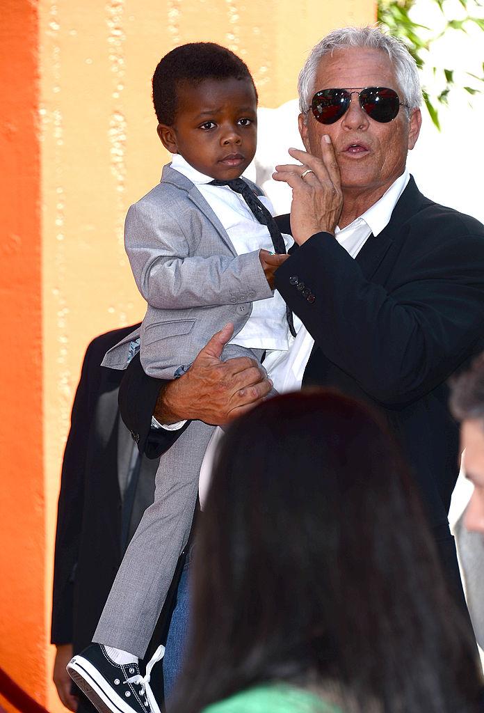 Sandra Bullock's son, Louis, watching from the sidelines as his mom is immortalized with a hand-and-footprint ceremony in Hollywood, 2013 (©Getty Images | <a href="https://www.gettyimages.com/detail/news-photo/actress-sandra-bullocks-son-louis-bardo-bullock-is-seen-as-news-photo/181806747">Jason Merritt</a>)