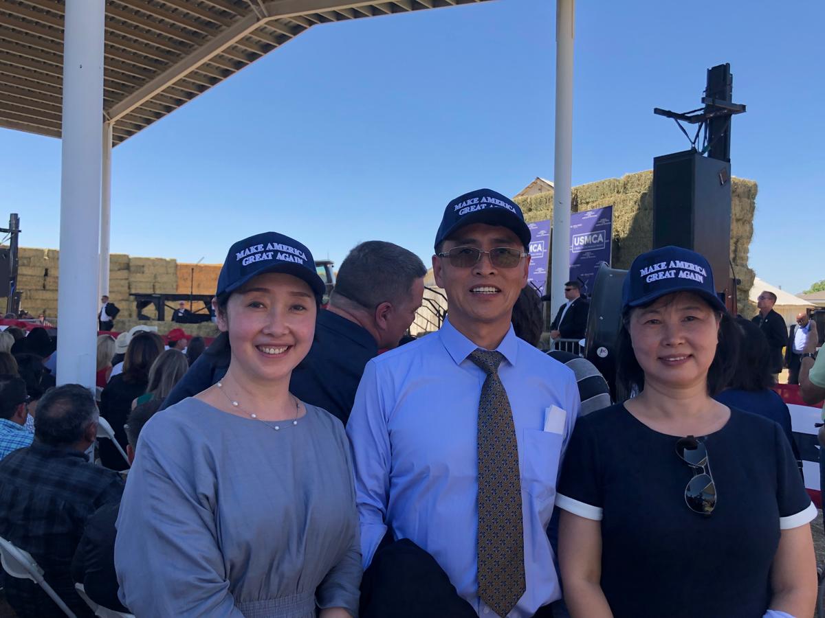 (Left to Right) Dafang Wang, Ming Yu, and Zhonghua Lu with Make America Great Again hats during the USMCA event on July 10, 2019. (Cynthia Cai/Epoch Times)