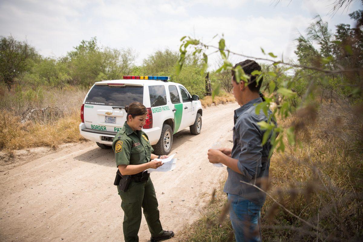 Marlene Castro, Supervisory Border Patrol Agent, speaks to a group of unaccompanied minors who crossed the Rio Grande River from Mexico into the United States in Hidalgo County, Texas, on May 26, 2017. (Benjamin Chasteen/The Epoch Times)