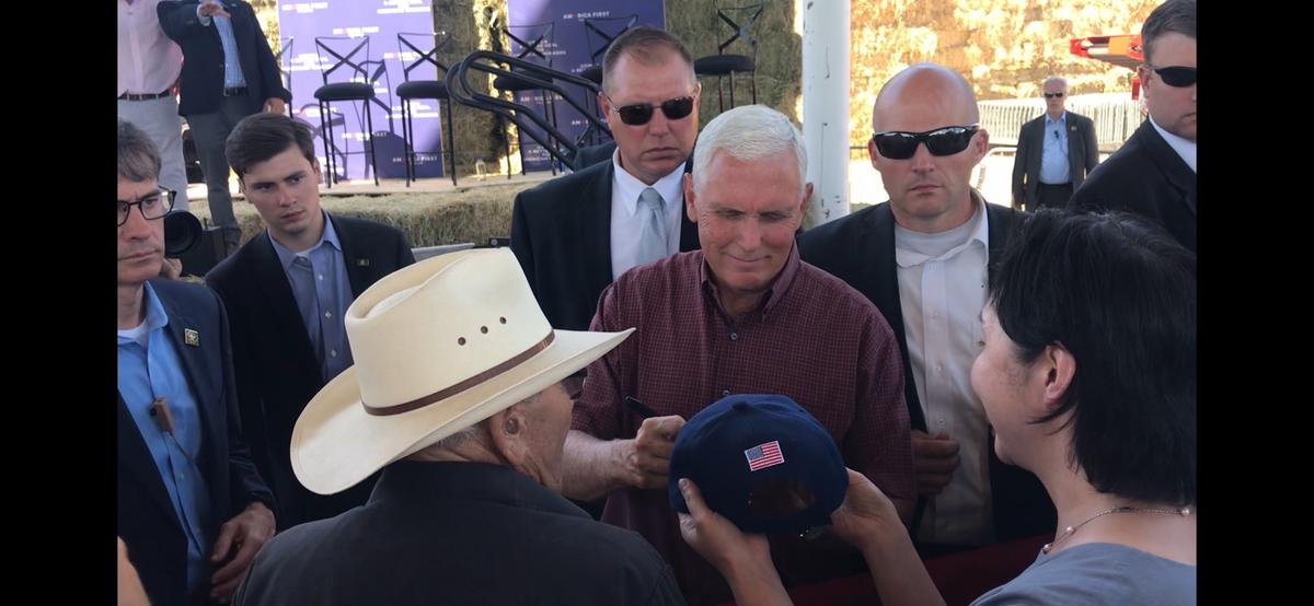 Vice President Mike Pence signs Dafang Wang's hat during the USMCA event on July 10, 2019. (Cynthia Cai/Epoch Times)