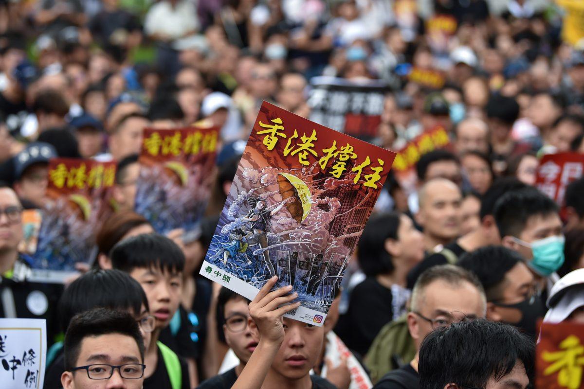 Protesters gather before a march to the West Kowloon railway station, where high-speed trains depart for the Chinese mainland, during a demonstration against a proposed extradition bill in Hong Kong on July 7, 2019. (Hector Retamal/AFP/Getty Images)