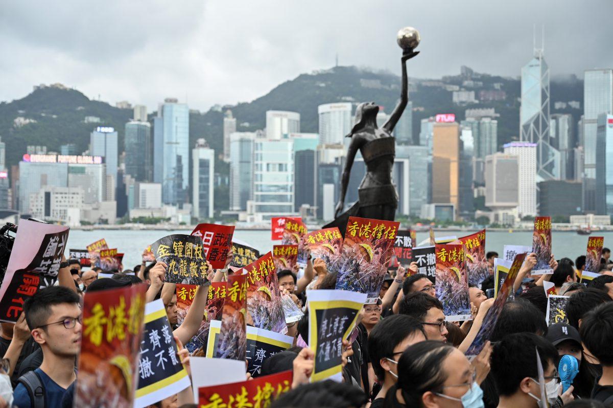 Protesters gather before a march to the West Kowloon railway station, where high-speed trains depart for the Chinese mainland, during a demonstration against a proposed extradition bill in Hong Kong on July 7, 2019. (Hector Retamal/AFP/Getty Images)