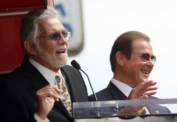 Actor David Hedison (L) delivers a speech as British actor Sir Roger Moore (R) is honored with a Star on the Hollywood Walk of Fame in Hollywood, California, on Oct. 11, 2007. (Gabriel Bouys/AFP/Getty Images)