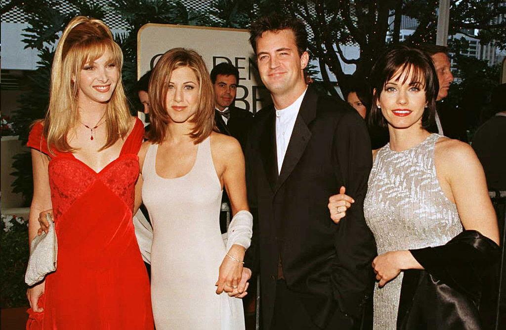 The cast of the hit TV show "Friends" from L-R: Lisa Kudrow, Jennifer Aniston, Matthew Perry, and Courteney Cox pose for photographers as they arrive for the 53rd Annual Golden Globe Awards in Beverly Hills, California on Jan. 21, 1996. (Mike Nelson/AFP/Getty Images)