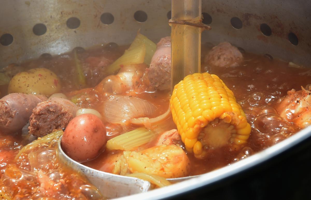 The seafood and accompaniments are all slow-cooked in a spicy broth known as 'the boil.' (Rick Diamond/Getty Images for Country Thunder USA)
