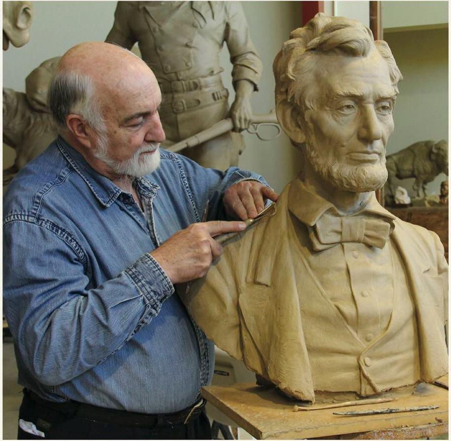 Artist and instructor Ed Fraughton with his sculpture of Abraham Lincoln. (New Masters Academy)