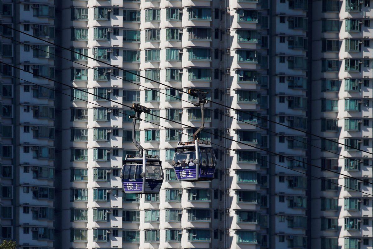 Cable cars move past residential flats at Lantau Island in Hong Kong, China on May 30, 2018. (Bobby Yip/Reuters)