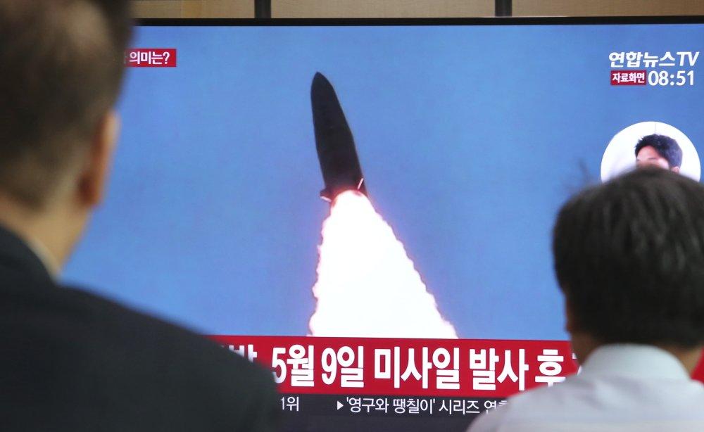 People watch a TV showing a file image of North Korea's missile launch during a news program at the Seoul Railway Station in Seoul, South Korea, on July 25, 2019. (Ahn Young-joon/AP Photo)