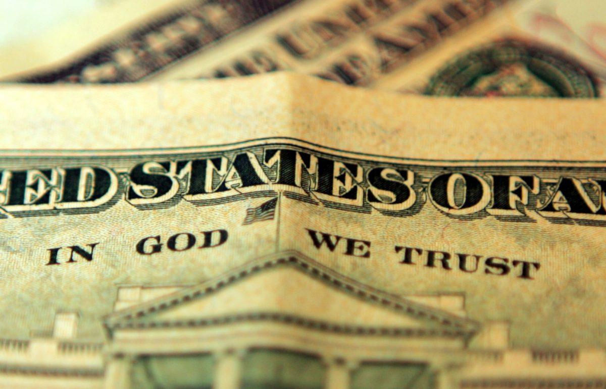 The phrase "In God We Trust" can be seen on an American ten-dollar bill. (Hugh Pinney/Getty Images)