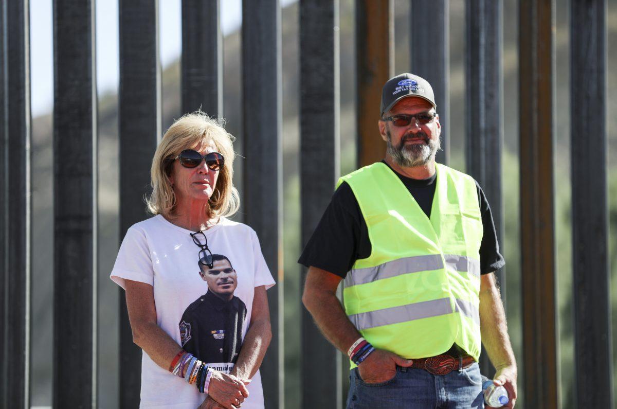 Angel parents Mary Ann Mendoza and Steve Ronnebeck, board members of We Build the Wall, at the official opening of the new half-mile section of border fence built at Sunland Park, N.M., on May 30, 2019. (Charlotte Cuthbertson/The Epoch Times)