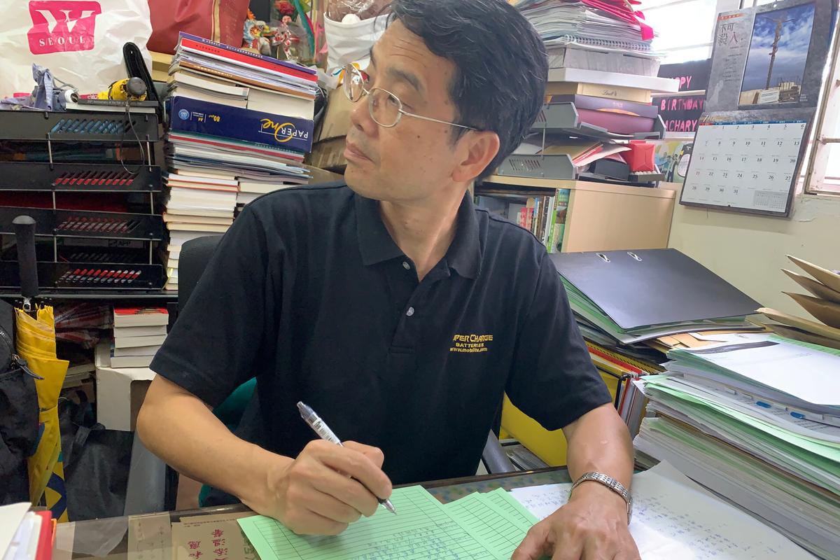 Zachary Wong, Democratic Party district councillor, sits in his office in Yuen Long, Hong Kong, China on July 23, 2019. (James Pomfret/Reuters)