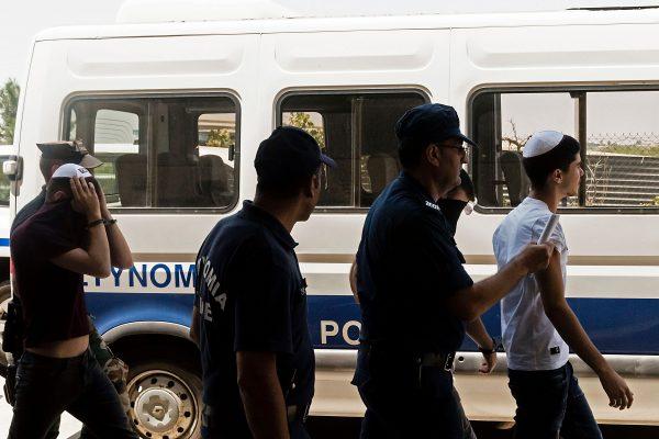Israeli tourists, suspected of raping a 19-year-old British girl in Ayia Napa, leave the court after a hearing in the eastern Cypriot resort of Paralimni on July 26, 2019. (IAKOVOS HATZISTAVROU/AFP/Getty Images)