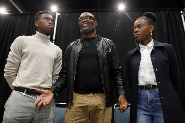 Mixed martial arts great Anderson "Spider" Silva of Brazil, daughter Kaory, 23 (R), and son Kalyl, 20 (L), talk to reporters after all were sworn in as U.S. citizens in a mass naturalization ceremony on July 23, 2019 at the Los Angeles Convention Center. (Reed Saxon/AP)