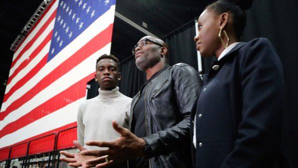 Mixed martial arts great Anderson "Spider" Silva of Brazil, daughter Kaory, 23 (R), and son Kalyl, 20 (L), talk to reporters after all were sworn in as U.S. citizens in a mass naturalization ceremony on July 23, 2019 at the Los Angeles Convention Center. (Reed Saxon/AP)