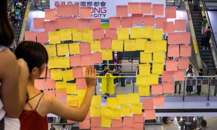Post-it notes and a yellow raincoat is seen during the rally against a controversial extradition bill in the arrivals hall of the international airport in Hong Kong, on July 26, 2019. (Billy H.C. Kwok/Getty Images)