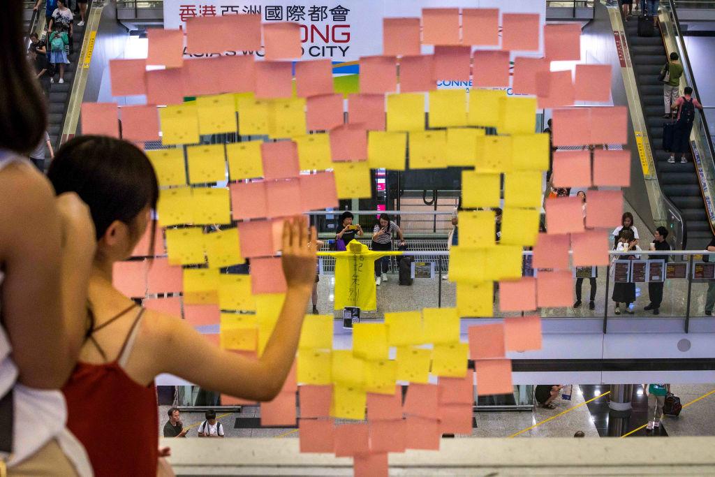 Post-it notes and a yellow raincoat during the rally against a controversial extradition bill in the arrivals hall of the international airport in Hong Kong on July 26, 2019. (Billy H.C. Kwok/Getty Images)