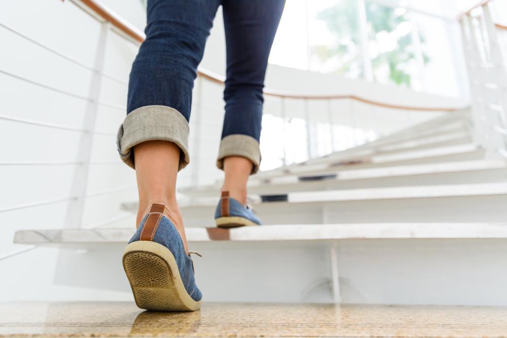 Illustration - Shutterstock | <a href="https://www.shutterstock.com/image-photo/young-adult-woman-walking-stairs-sun-1020758239?src=0XIwsE9vV8DcZZwv1uuygg-1-3&studio=1">siam.pukkato</a>