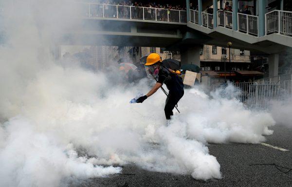 A demonstrator reacts to tear gas during a protest against the Yuen Long attacks in Yuen Long, New Territories, Hong Kong, China, on July 27, 2019. (Tyrone Siu/Reuters)