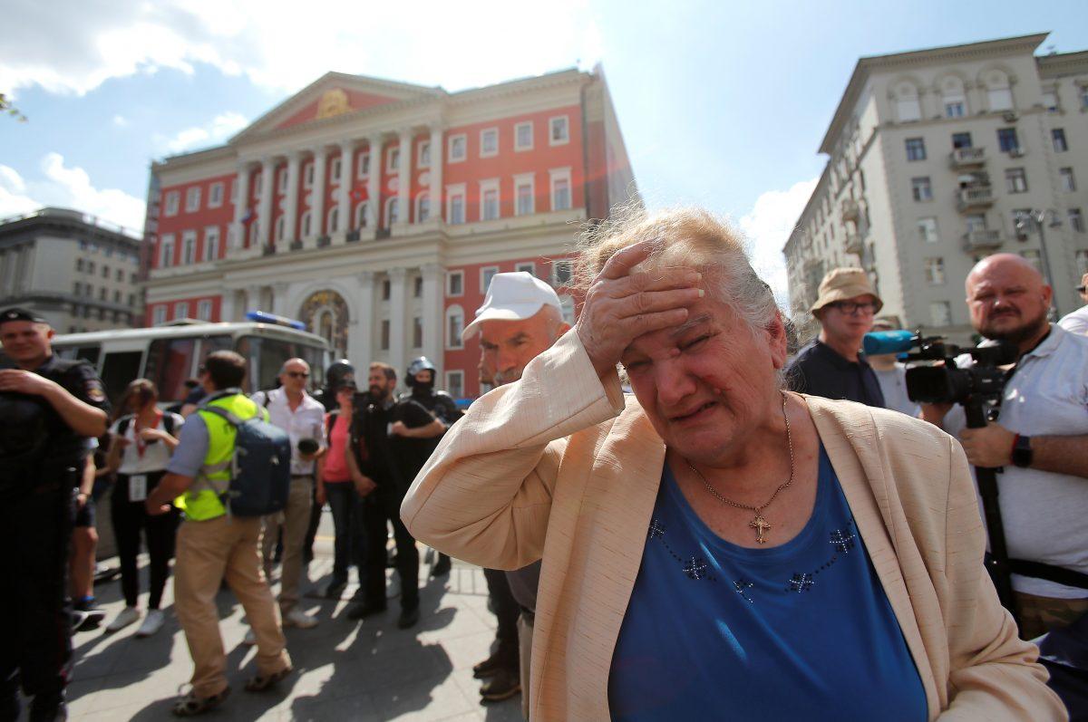 A woman reacts during a rally calling for opposition candidates to be registered for elections to Moscow City Duma, the capital's regional parliament, in Moscow, Russia July 27, 2019. (Reuters/Maxim Shemetov)