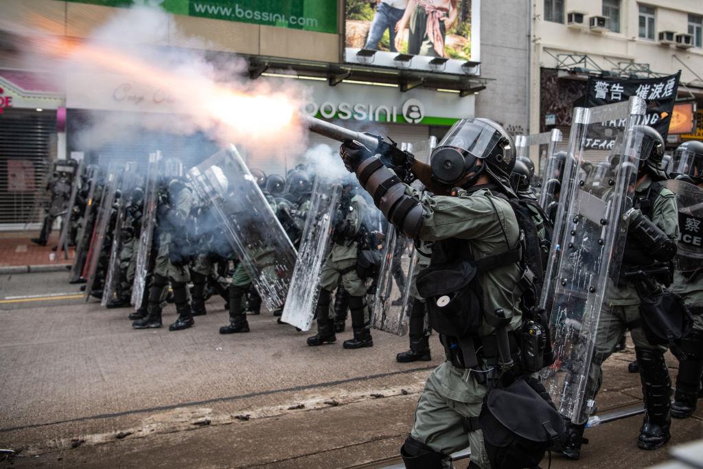 Riot police fire tear gas towards protesters in the district of Yuen Long, Hong Kong on July 27, 2019. (Laurel Chor/Getty Images)