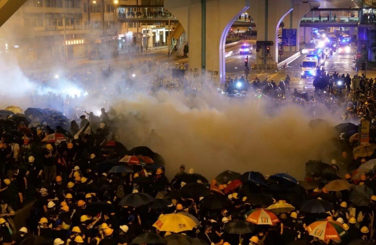 Police fired tear gas bullets to disperse the protesters after a major demonstration in Yuen Long district in Hong Kong, on July 27, 2019. (David Pong/The Epoch Times)
