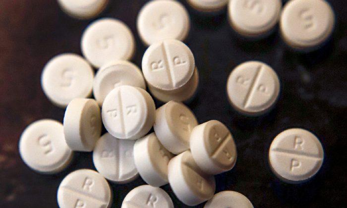 Big Question in Opioid Suits: How to Divide Any Settlement