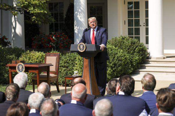 President Donald Trump speaks at the signing of the 9/11 Victim Compensation Fund bill in the White House Rose Garden on July 29, 2019. (Charlotte Cuthbertson/The Epoch Times)